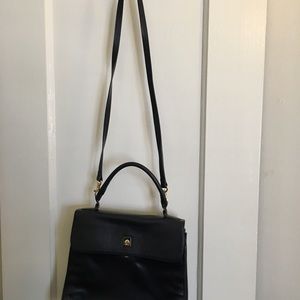 Etienne Aigner navy blue handbag.